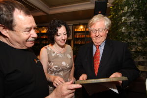 BBG Governor Ambassador Victor Ashe looks at his  Glasnost Award with Radio Liberty star human rights reporter Kristina Gorelik at his side. 