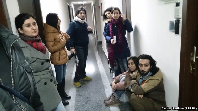 Baku-based RFE/RL Azerbaijani Service journalists forced from their bureau during raid by police and investigators, 26 Dec 2014
