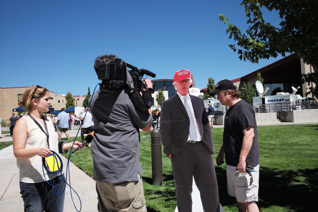 A German TV crew interviewing a Clinton supporter next to a Donald Trump cutout outside of an auditorium in Reno, Nevada where Hillary Clinton was speaking Thursday, August 25, 2016.
